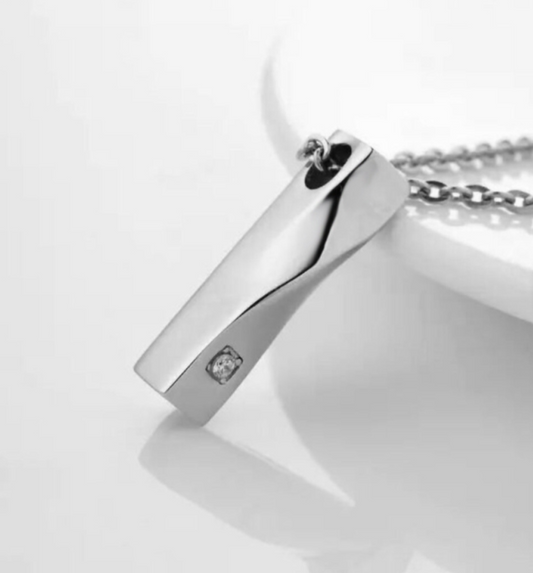 Elegant Silver Ashes Necklace in sterling silver with cubic zirconia stone and secure screw-top design for ashes.