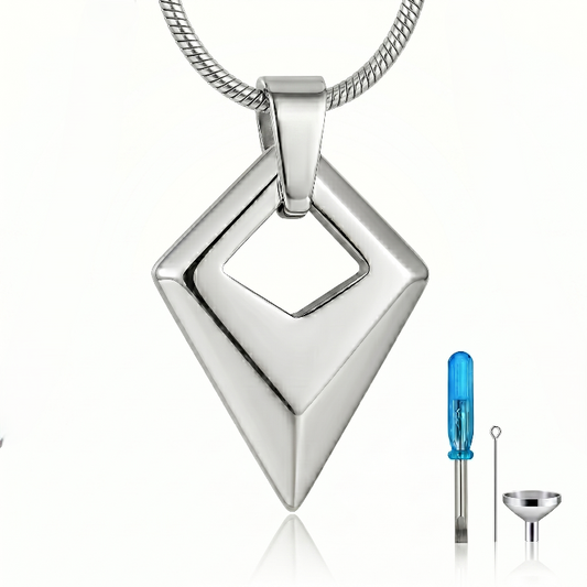 Prism of Love Cremation Necklace – polished silver stainless steel diamond-shaped memorial pendant measuring 25mm x 18.2mm, shown with filling funnel and screwdriver tool kit on white background.