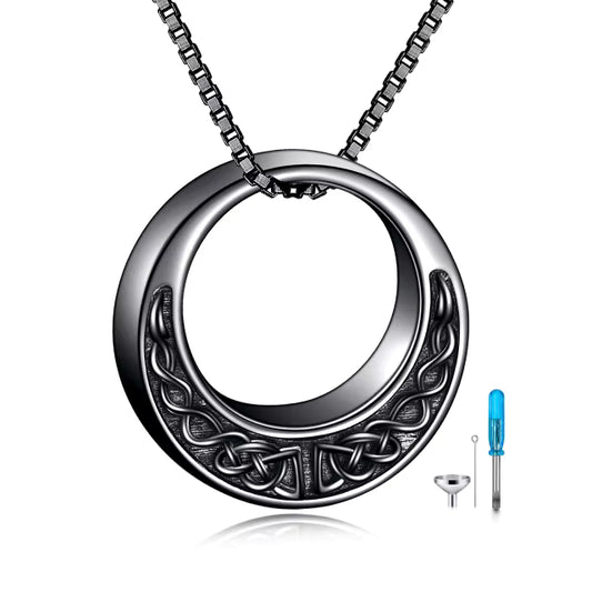 Round Celtic knot urn necklace in dark sterling silver designed to hold cremation ashes securely.