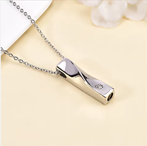 Elegant Silver Ashes Necklace in sterling silver with cubic zirconia stone and secure screw-top design for ashes.