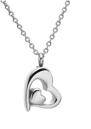 A silver heart-shaped pendant necklace with a polished finish, featuring a larger open heart enclosing a smaller solid heart, suspended from a delicate silver link chain against a plain white background.