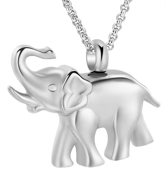 Polished stainless steel elephant cremation necklace with raised trunk, designed to hold a small amount of ashes as a memorial keepsake.
