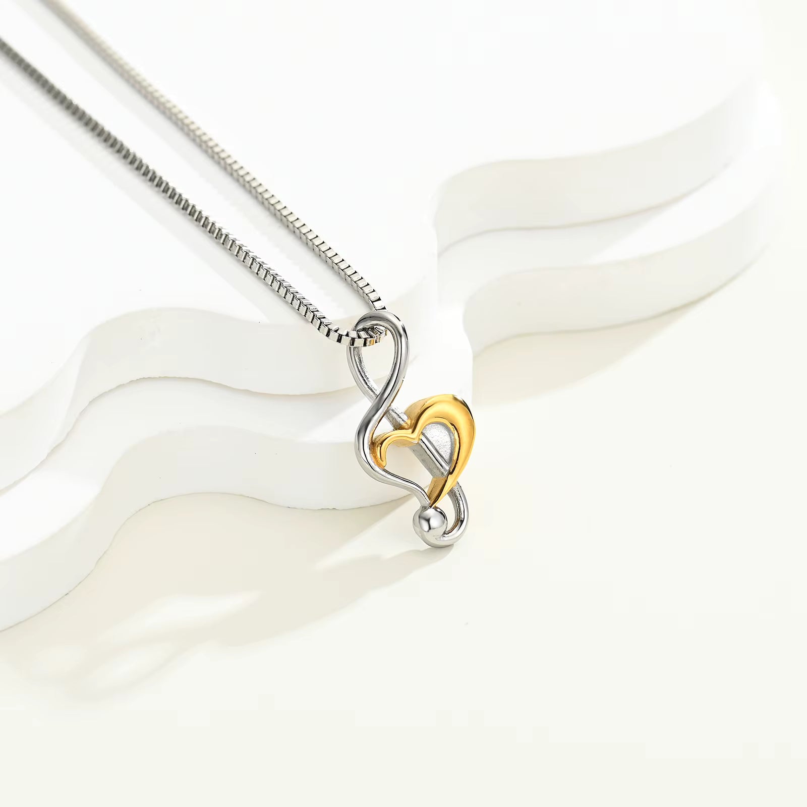 stainless steel infinity heart cremation pendant with rose-gold accent