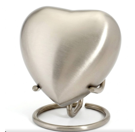 Serenity Gold Band heart-shaped keepsake urn open on stand in brushed pewter — memorial cremation locket for ashes or keepsakes