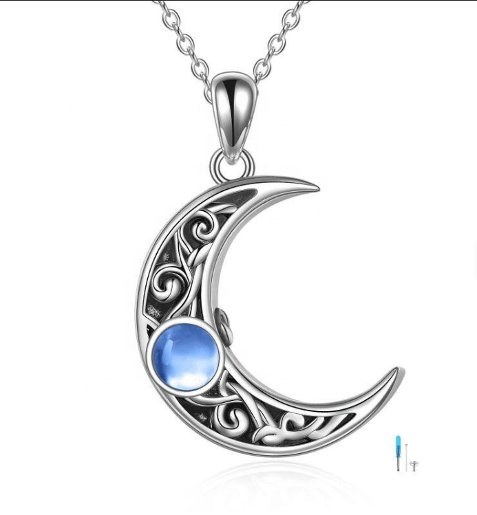 Sterling silver Celtic knotwork crescent moon urn pendant with blue cabochon, shown with screwdriver and pin