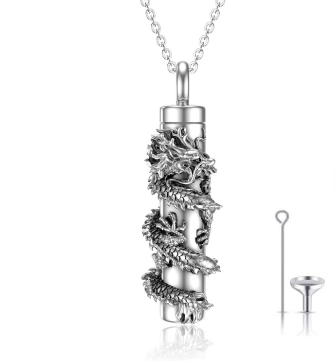 Sterling silver dragon coiled around a cylinder urn pendant, shown with funnel and pin fill kit